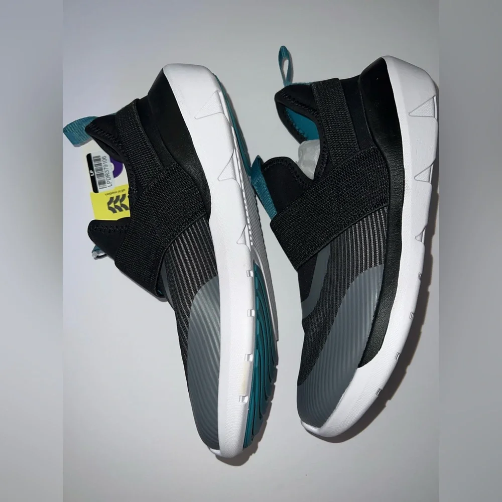 Kids Black Slip-On Athletic Shoes with Teal Accents